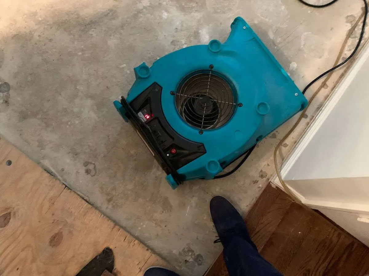Air mover drying subfloor during Leak Detection & Repair in Gages Lake